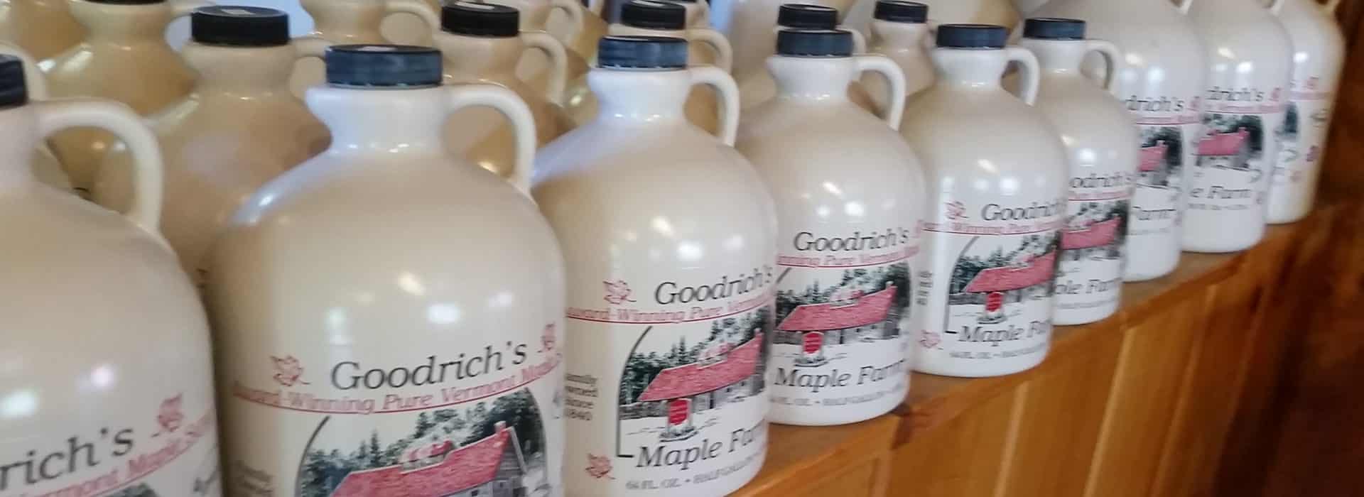 several plastic jugs of maple syrup from Goodrich farm in vermont