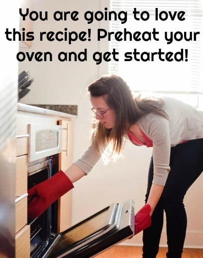 woman reaching into oven