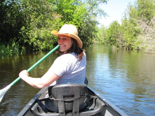 woman having a great time paddling in a kayak on the Clyde River