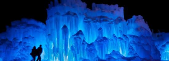 couple standing in front of the Ice castles