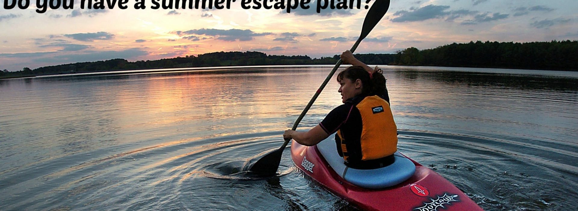 girl paddling a red kayak on a Vermont lake