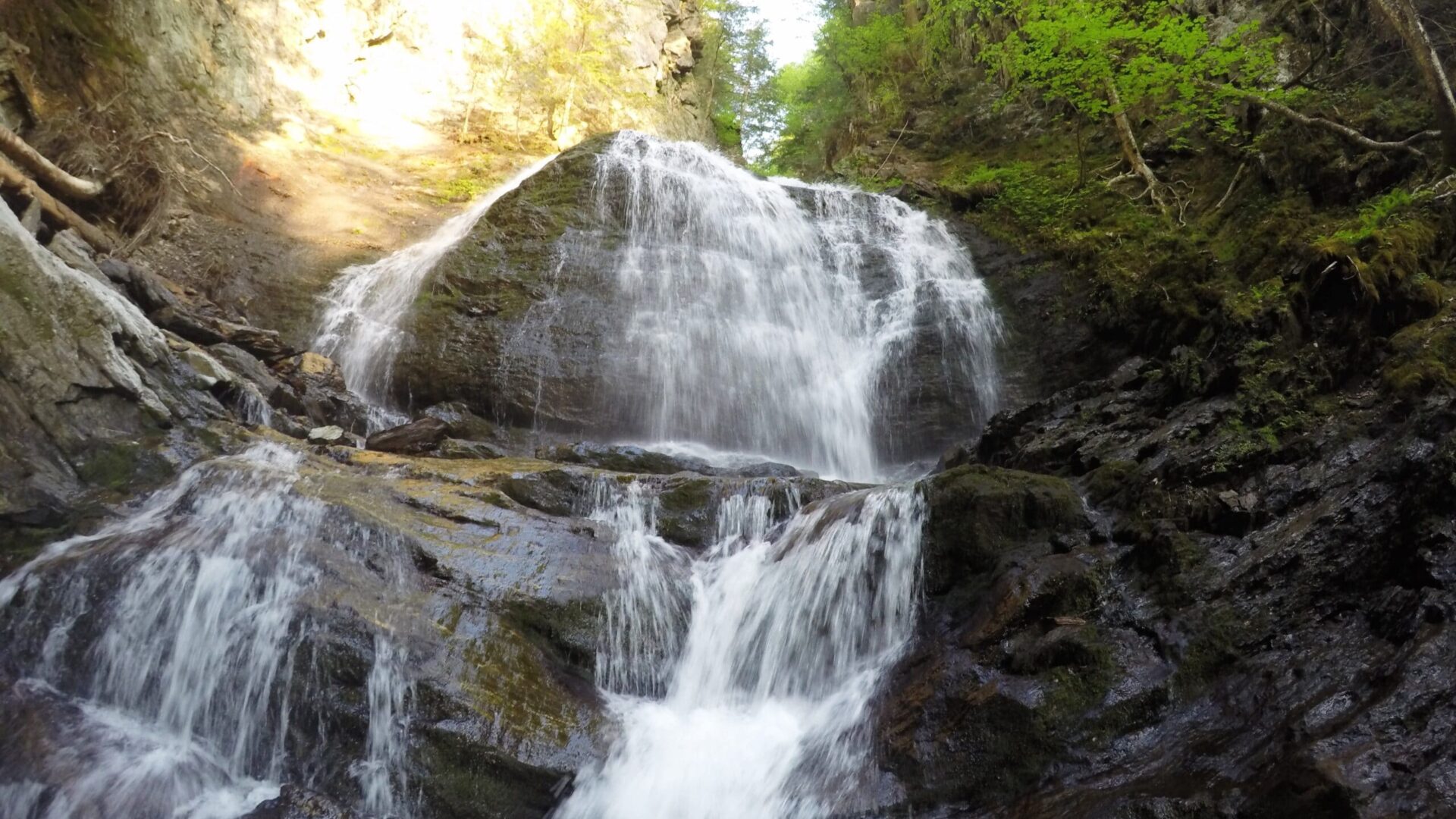 rushing waterfall at the Moss Glen Falls trail Stowe Vermont|rushing waterfall in Vermont|trail sign at Moss Glen Falls Trail Vermont|trail sign at Moss Glen Falls Trail Stowe Vermont