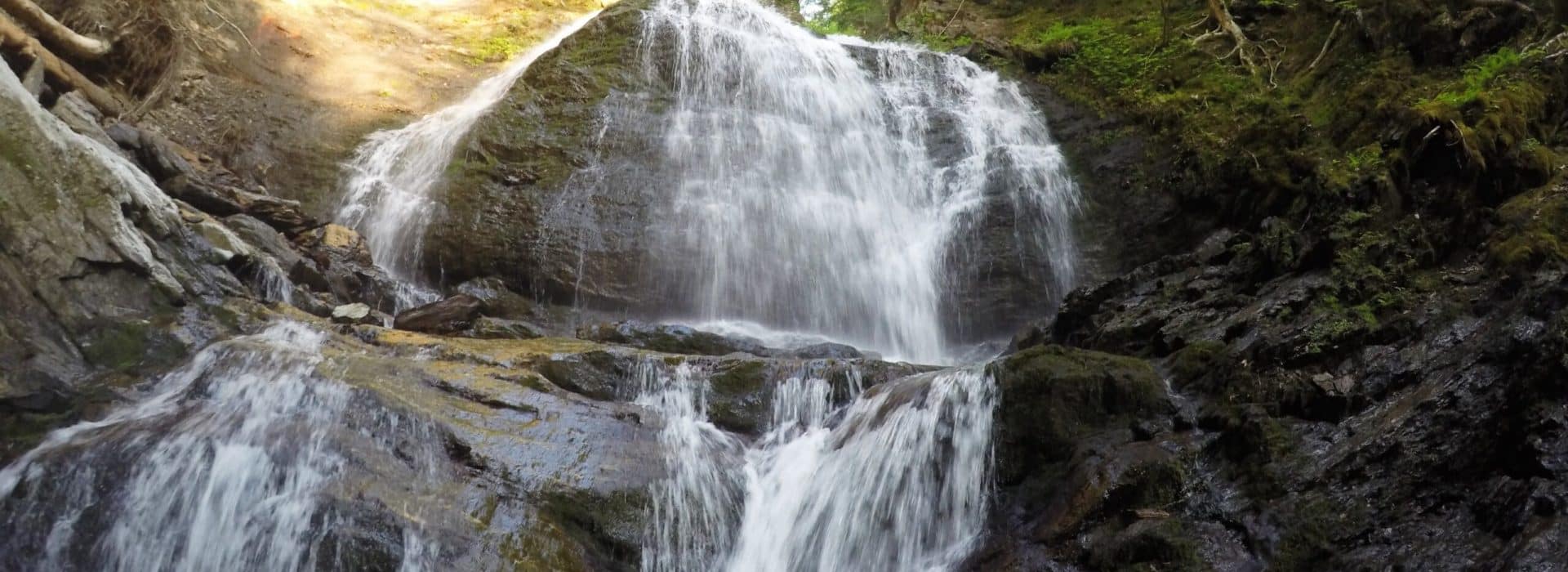 rushing waterfall at the Moss Glen Falls trail Stowe Vermont|rushing waterfall in Vermont|trail sign at Moss Glen Falls Trail Vermont|trail sign at Moss Glen Falls Trail Stowe Vermont