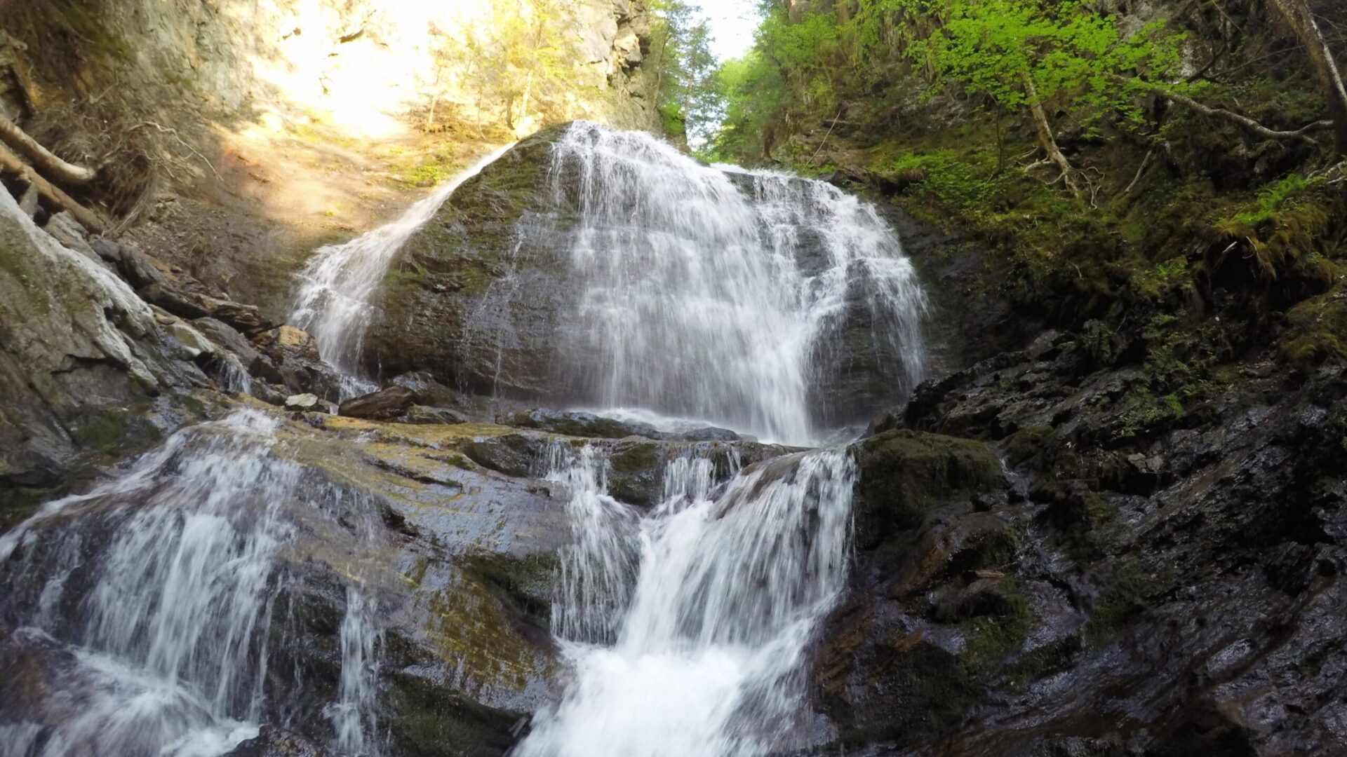 rushing waterfall at the Moss Glen Falls trail Stowe Vermont