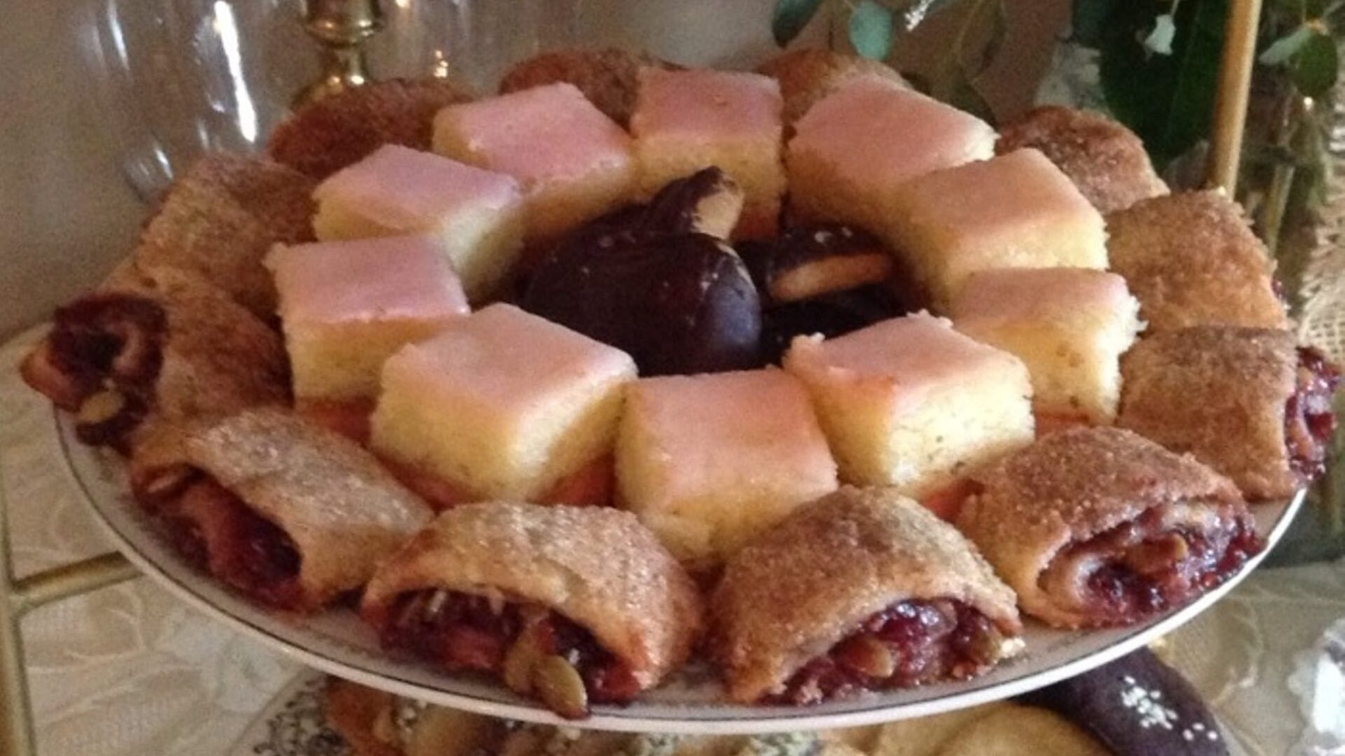 a plate with three varieties of small pastries