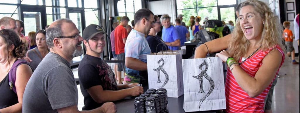 several people purchasing beer at the Alchemist brewery.