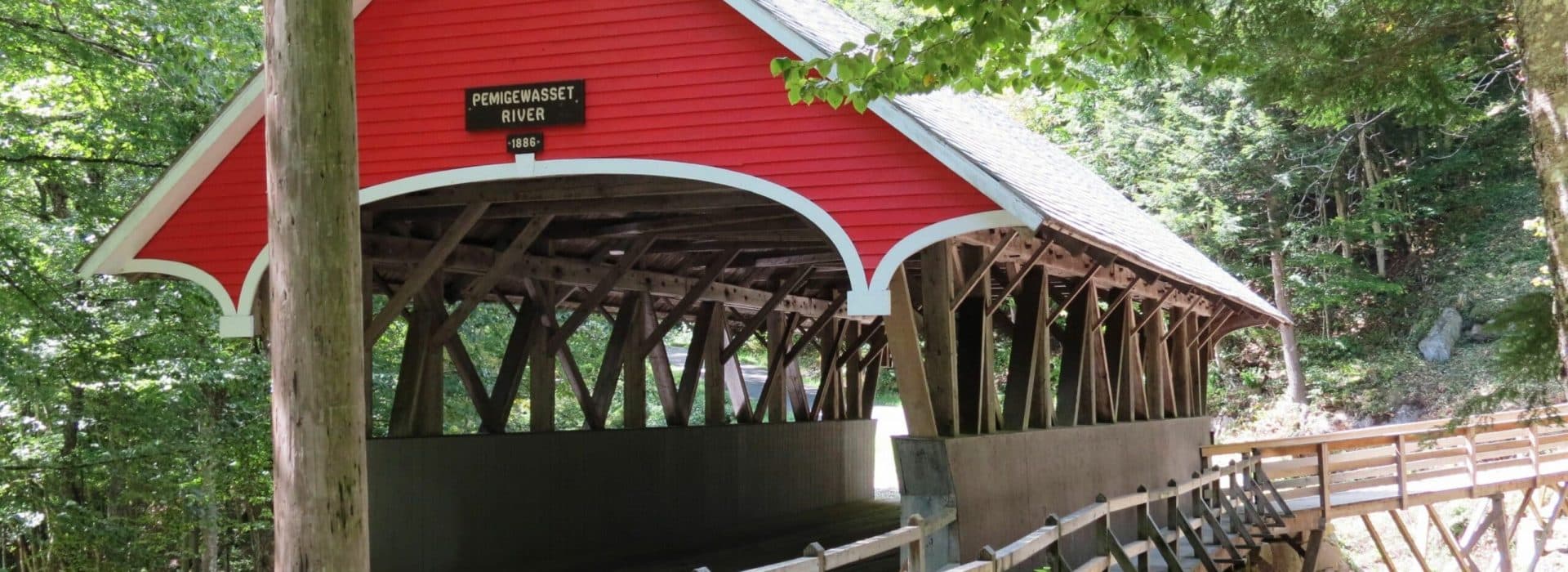red Covered bridge in New Hampshire|girl on covered bridge