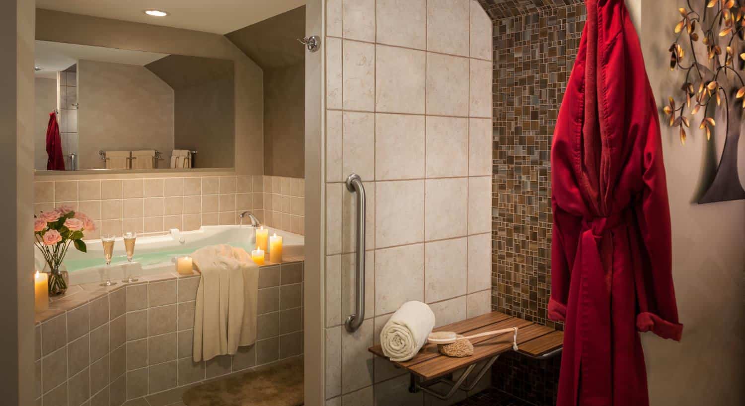 Bathroom with light and dark brown tiles on walls, floors, and around whirlpool tub