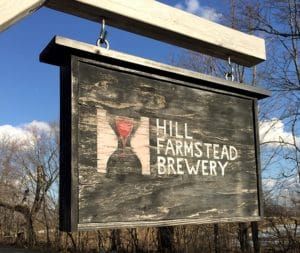| Rabbit Hill Inn wooden sign at Hill Farmstead Brewery in Vermont