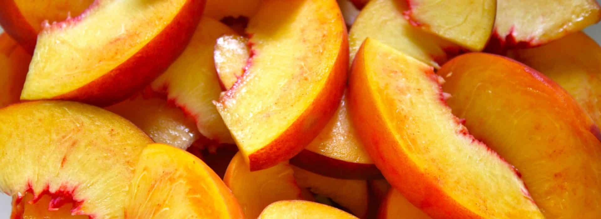 sliced peaches for peach BBQ sauce recipe.|fresh peaches|bowl of fresh peaches