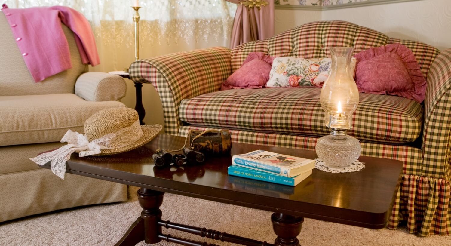 gingham plaid settee next to a chair and coffee table