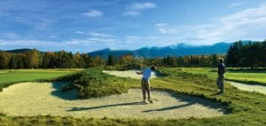 | Rabbit Hill Inn two men playing golf on a sunny day