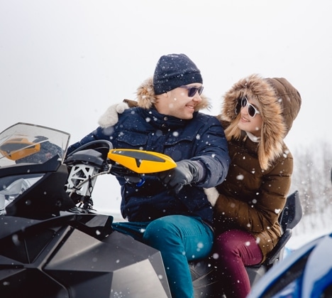 couple on a snowmobile