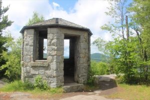 Historic round stone fire tower at the summit of Owl's Head trail
