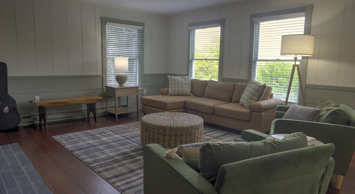 Cozy living room with sectional sofa and armchairs at one of the relaxing hotels near St Johnsbury VT